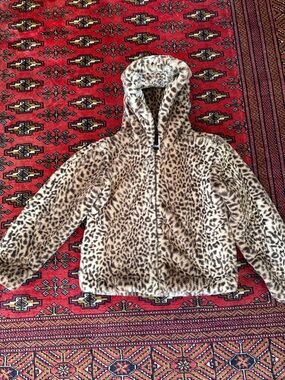 Faux leopard fur zip up hoodie.